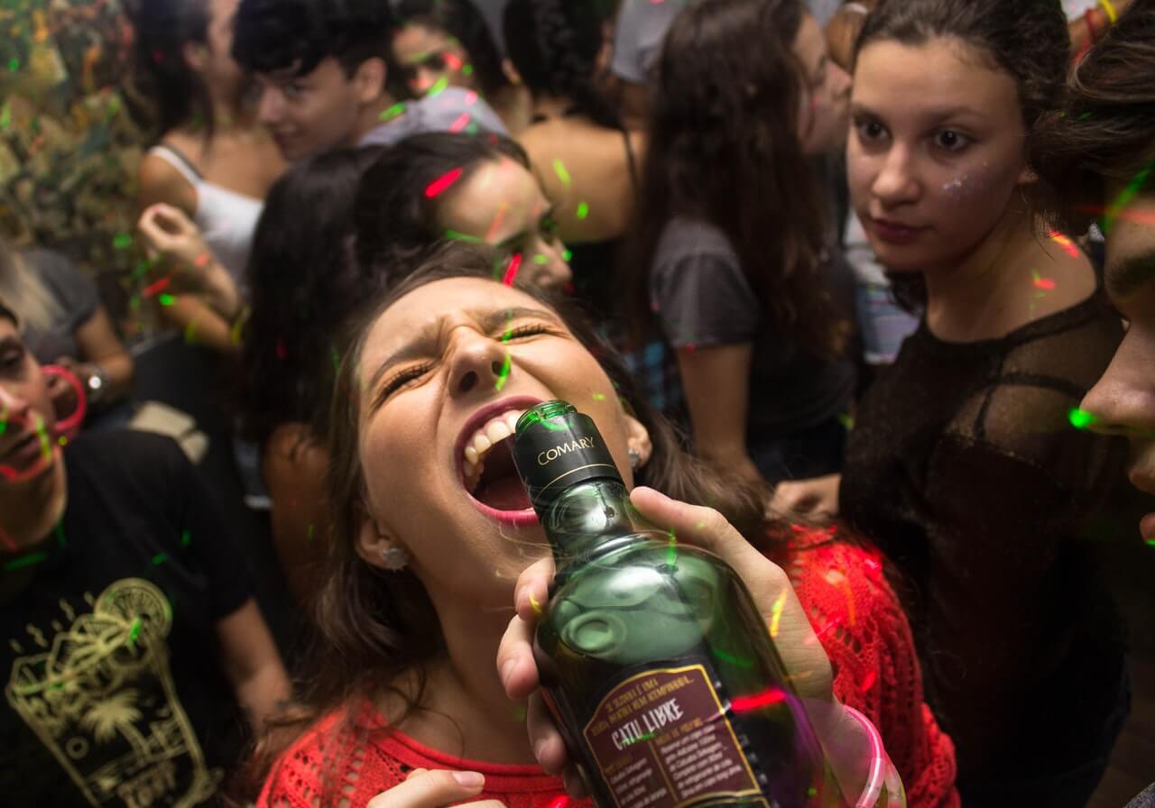 woman drinking from bottle