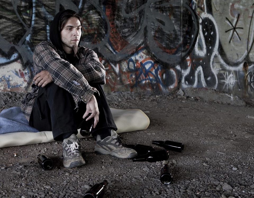 man sitting in alley