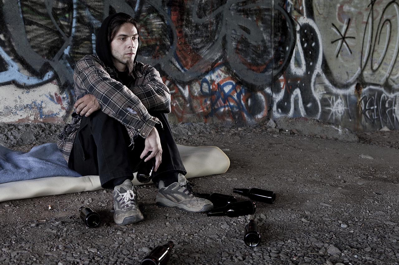 man sitting in alley