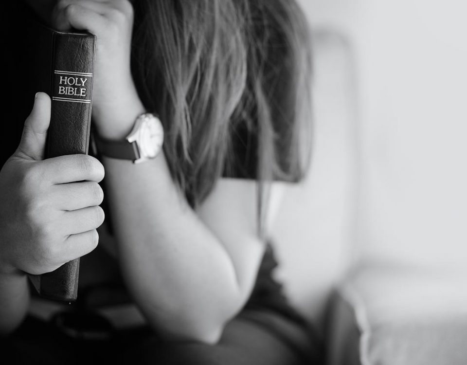 woman holding a bible